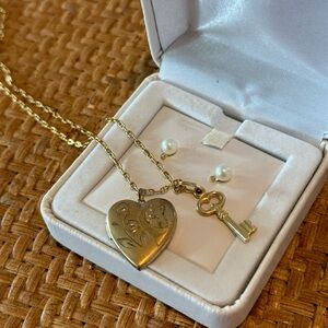 Heart shaped locket with key charm necklace and pearl/diamond earrings